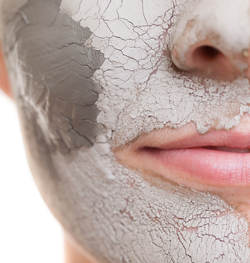 woman with clay face mask